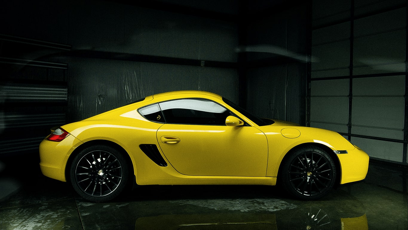 Damaged surface of a dull, scratched and dirty yellow sports car